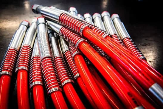 Construction fluid transfer hoses